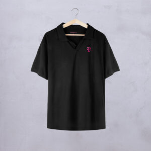 Front view of the BLACK POLO shirt hanging on a wooden hanger. The small, magenta-colored T logo on the chest is clearly visible.