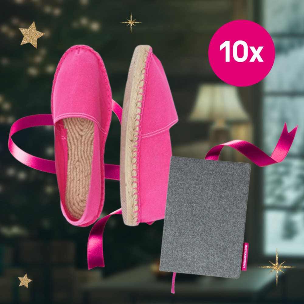 Magentafarbene Espadrilles und ein graues Notizbuch mit magentafarbenem Band von LOVE MAGENTA, abgebildet mit einem magentafarbenen "10x"-Kreis und goldenen Sternen.